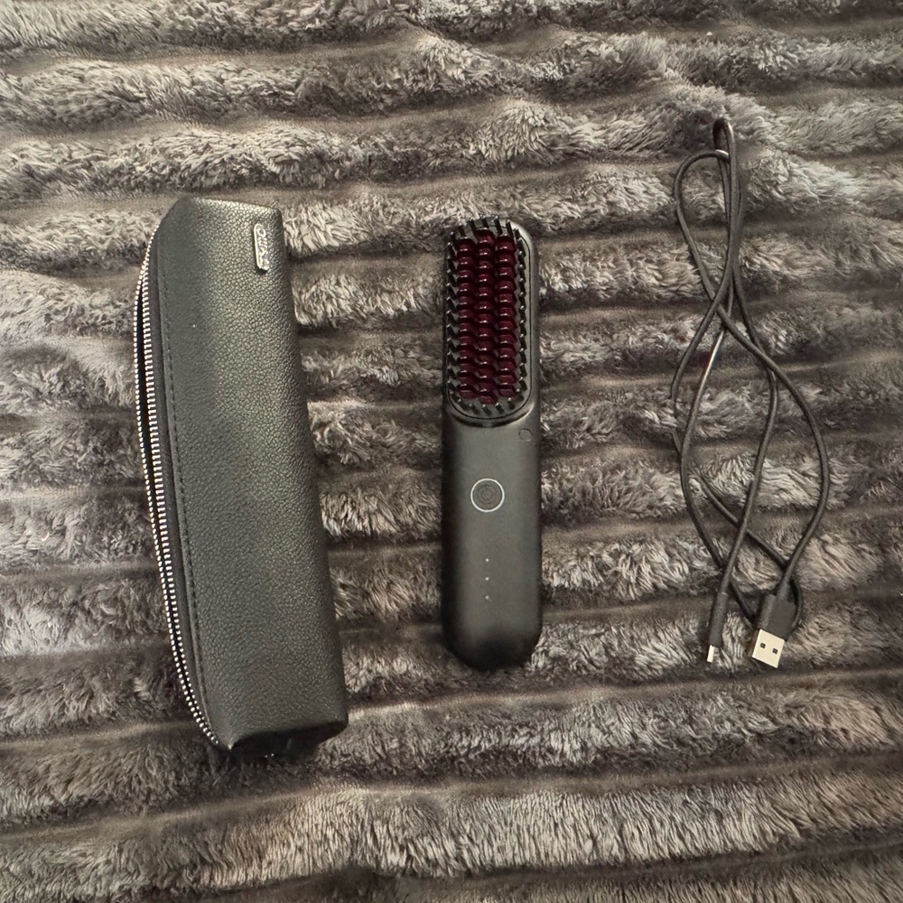 Sleek Black Grooming Brush by [Brand]